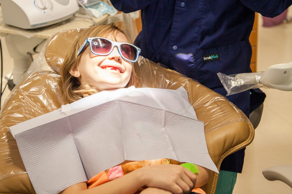 Young girl in dentist chair