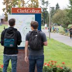 students looking at campus map