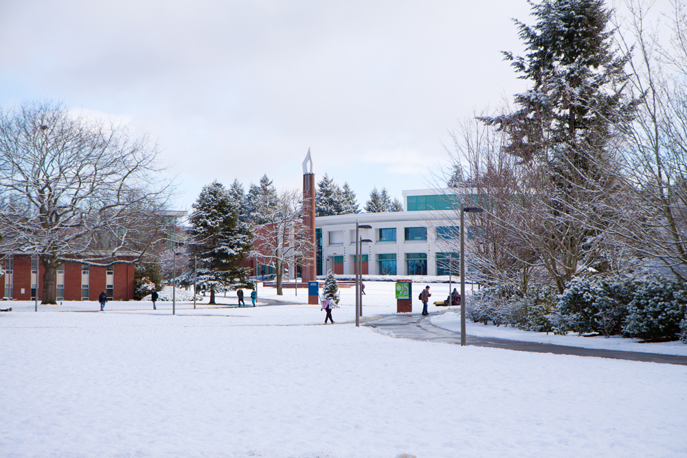 photo of Clark College campus covered in snow with students walking to classes