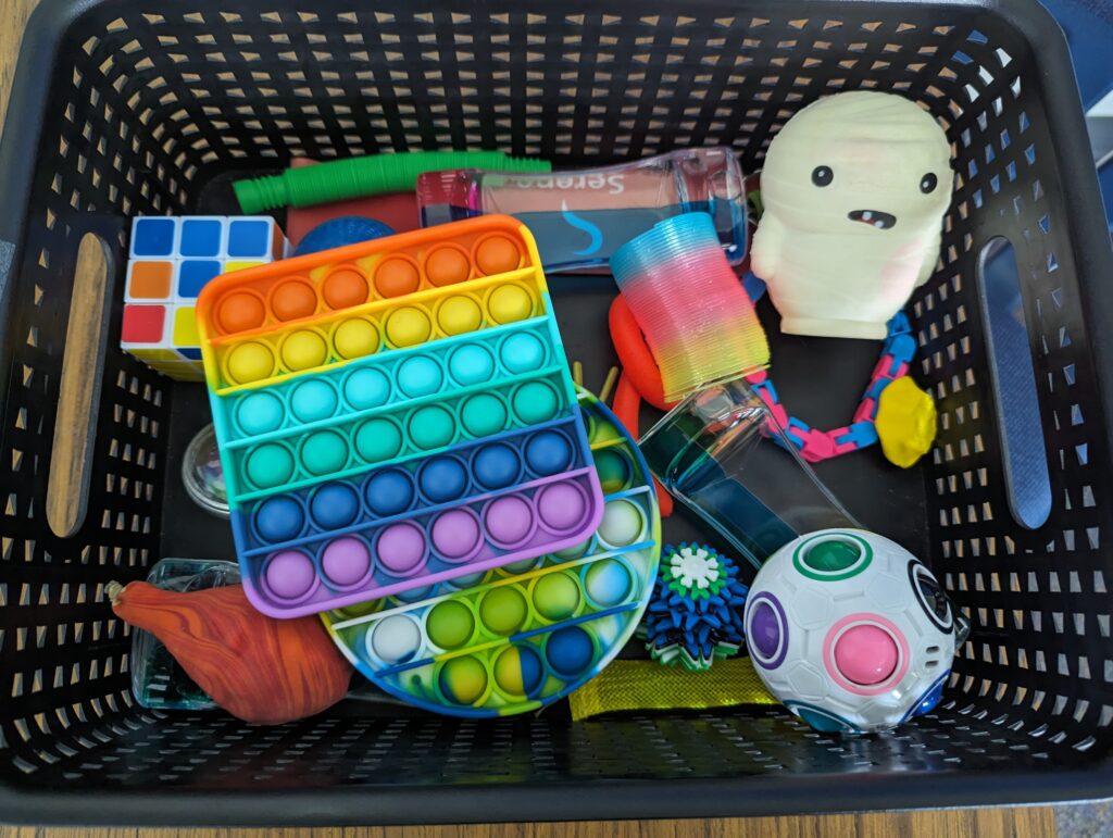 Basket of fidgets to keep hands busy.