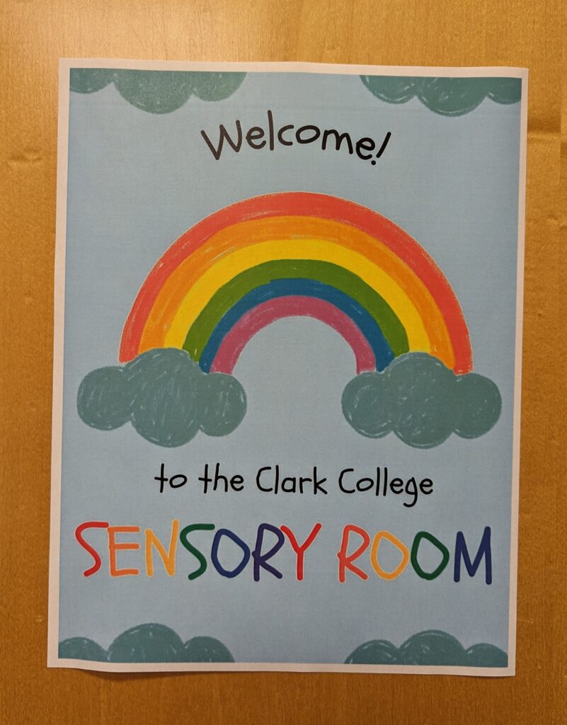 A sign on a door welcoming students to the Clark College Sensory Room
