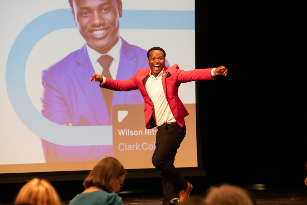 Wilson Nitunga dances in front of an audience.