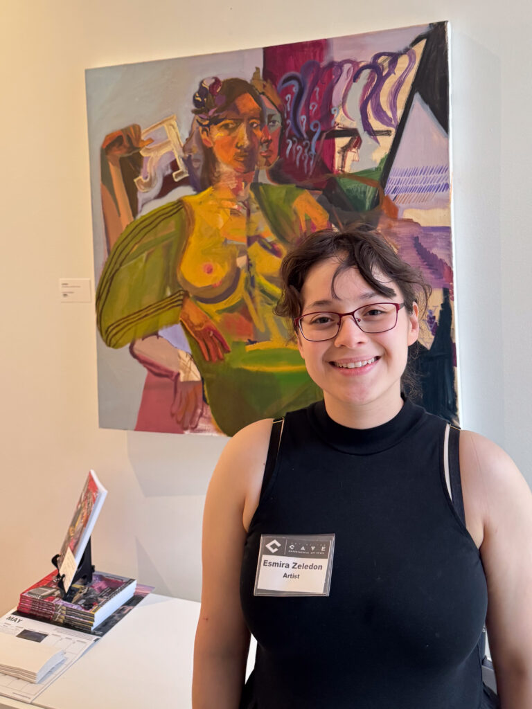 one person in front of artwork