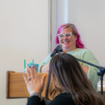 person at microphone