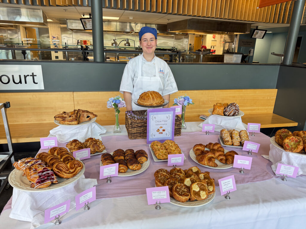 person in front of pastry