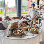 person in front of pastry