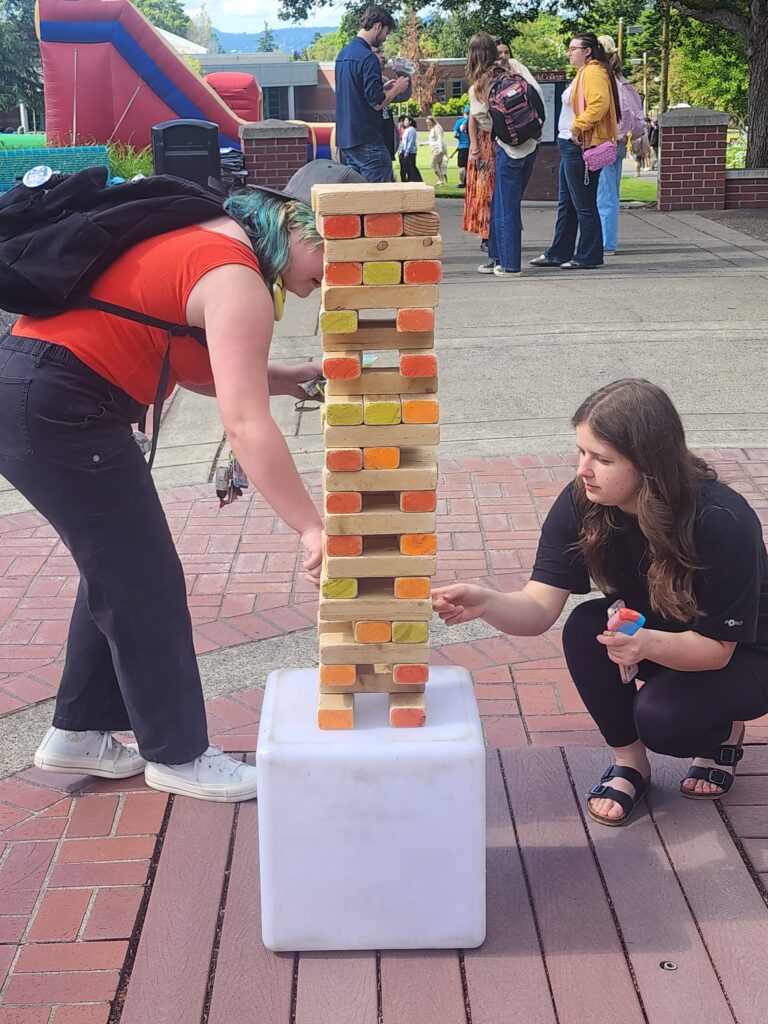two people with jenga
