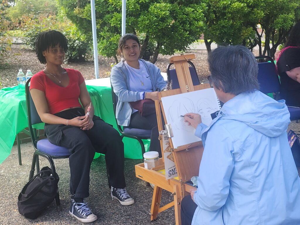 2 people pose for drawing
