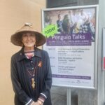 person in front of poster