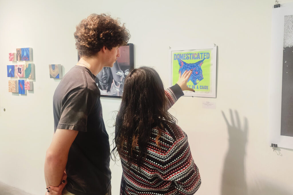 back of two people at art gallery