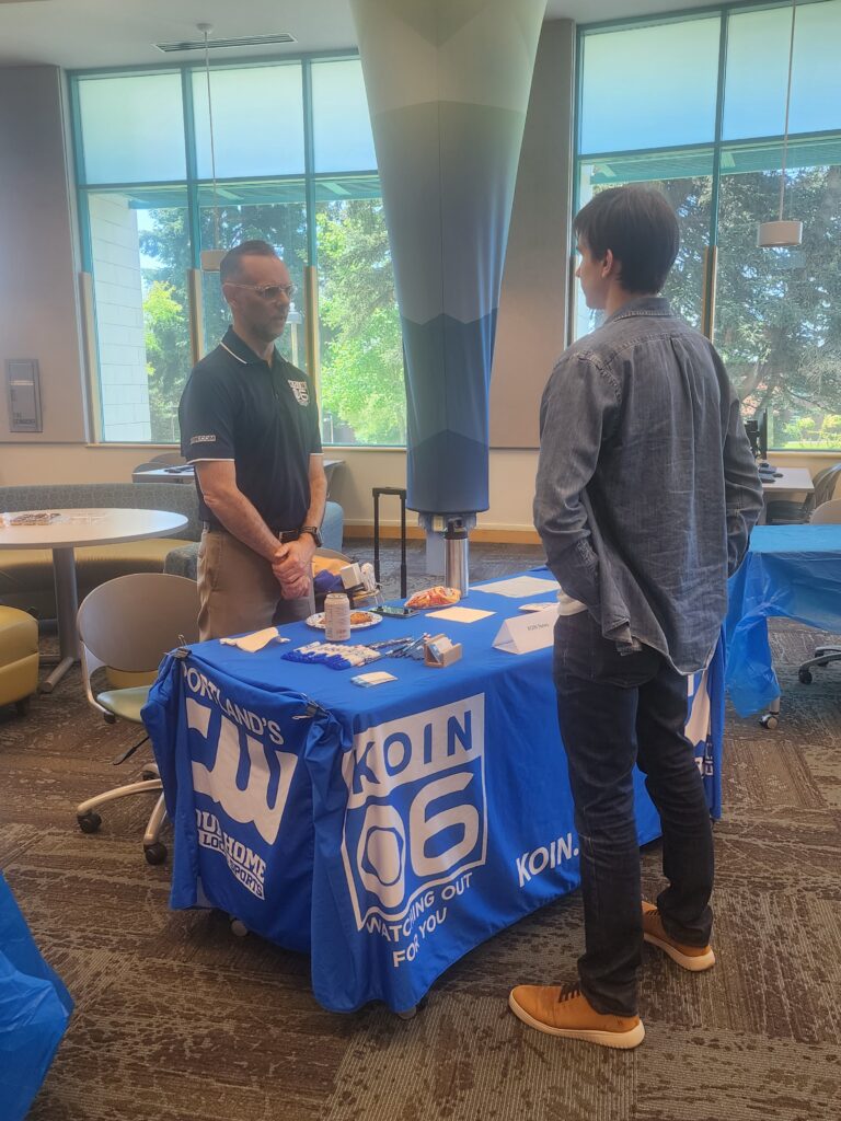 two people standing at table