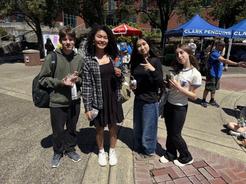 four people standing