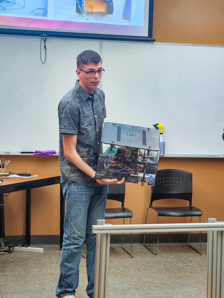 a person holds a box with technology inside