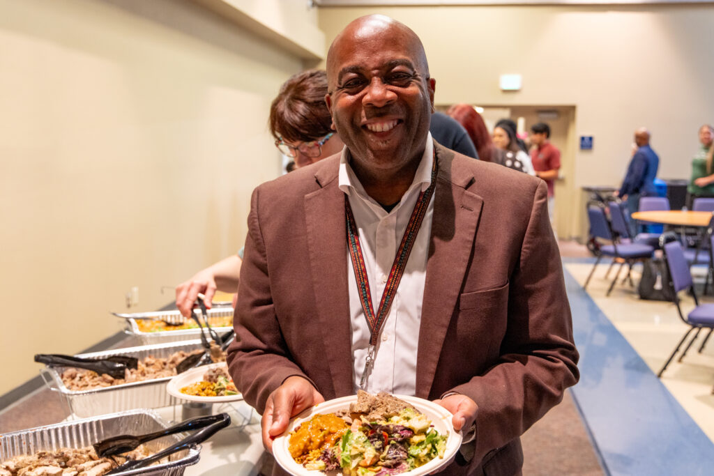 Dr. Terry Brown with a plate of food.