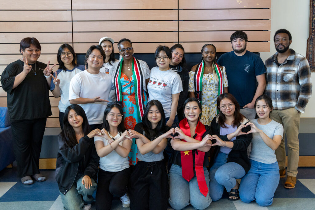 Group photo front row making hearts with their hands.