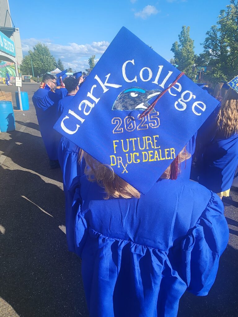 grad cap reads Clark College 2025 Future Drug Dealer